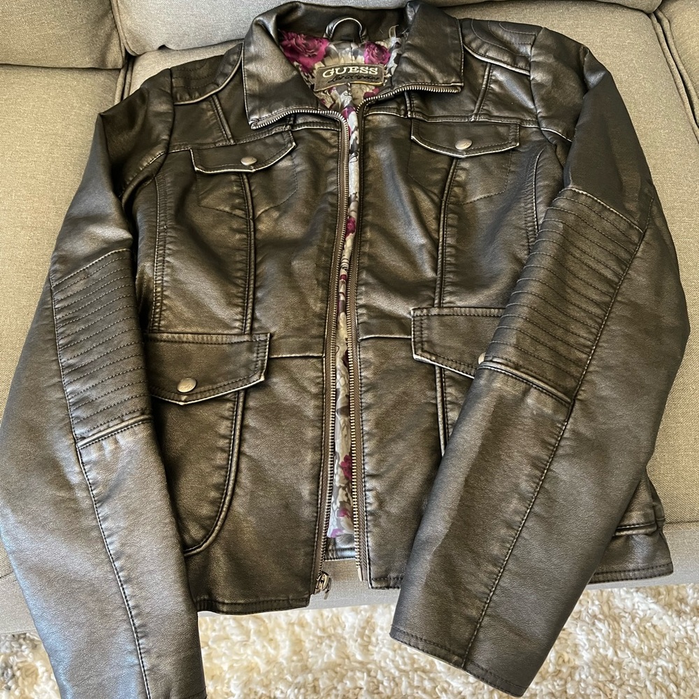 Distressed black leather jacket with fun and playful interior